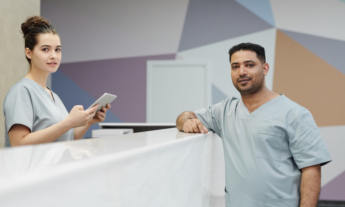 Modern veterinary clinic reception with staff at the front desk
